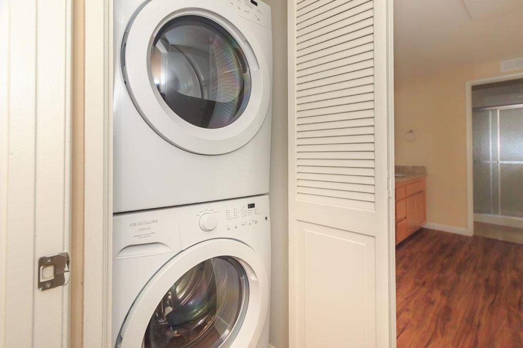 Apartments in Toluca Lake A laundry room with a washer and dryer, available in apartments for rent in Toluca Lake.